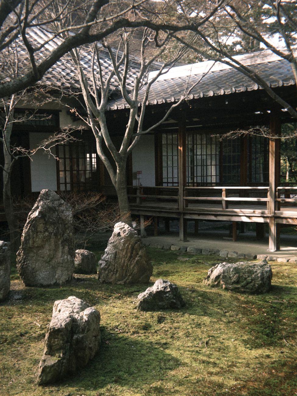 Traditional Japanese wooden machiya and zen garden courtyard in Kyoto
