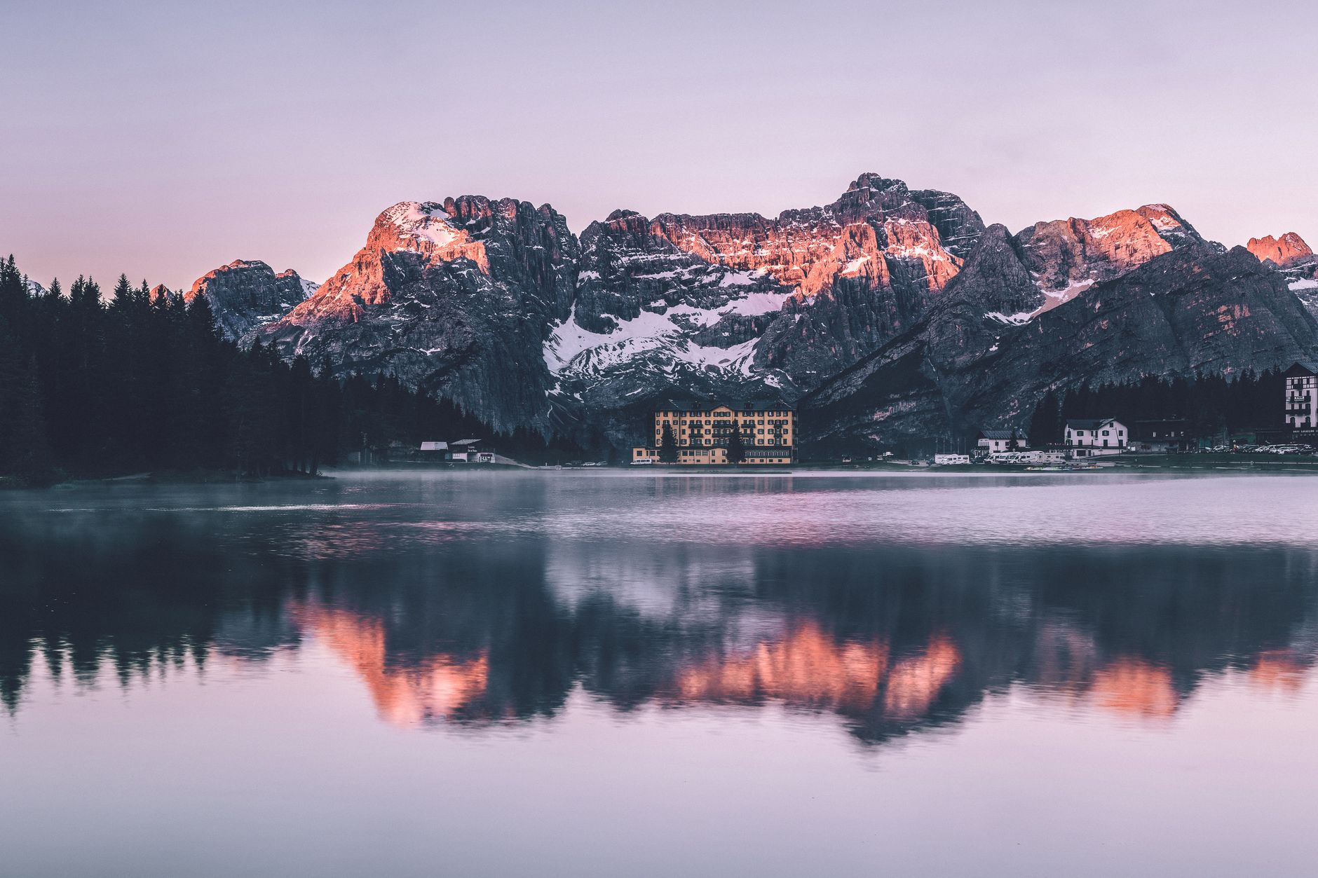 Tranquil mountain lake at sunrise in the Italian Dolomites